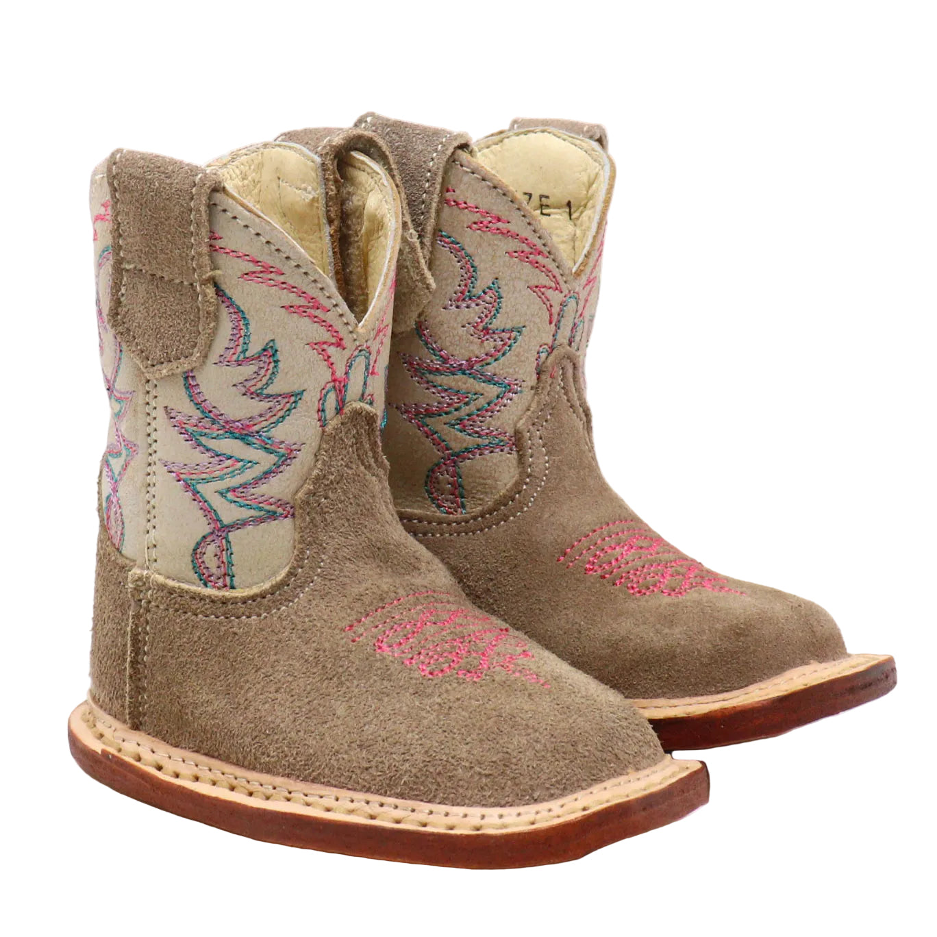 A pair of toddler western cowboy boots in taupe suede with pink and blue embroidery on the shafts and toes, shown against a plain white background.