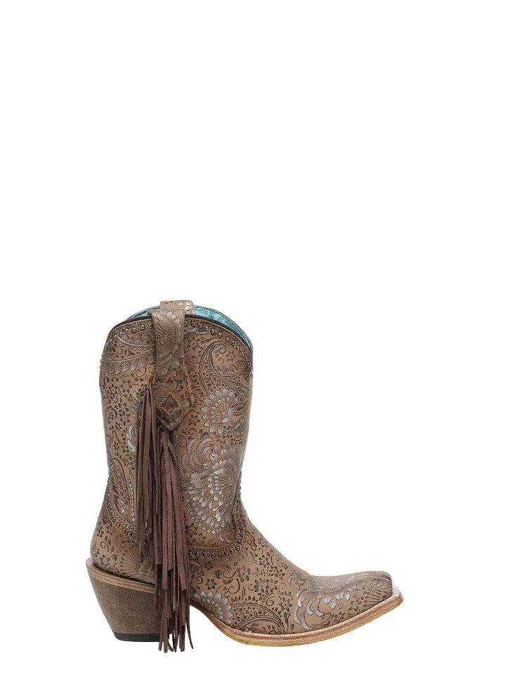Brown cowboy boot with intricate patterns and fringes on a light gray background