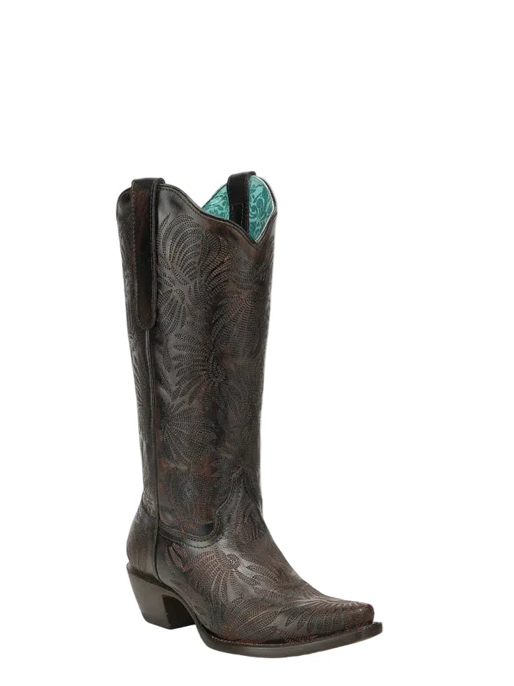 Brown cowboy boot with intricate designs on a white background