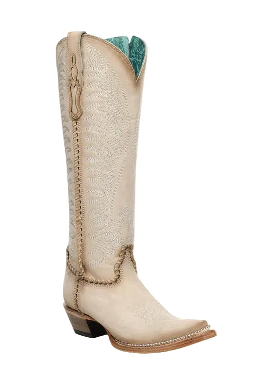 Beige cowboy boot with intricate stitching on a white background