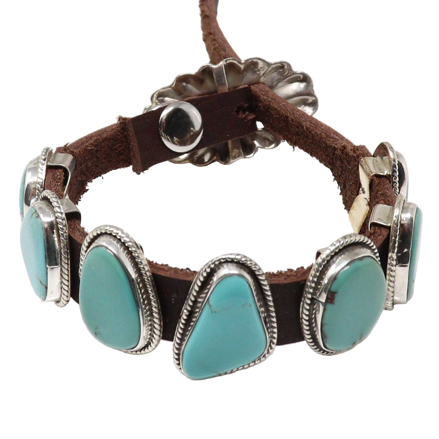 Bracelet with turquoise stones and brown leather strap on a white background