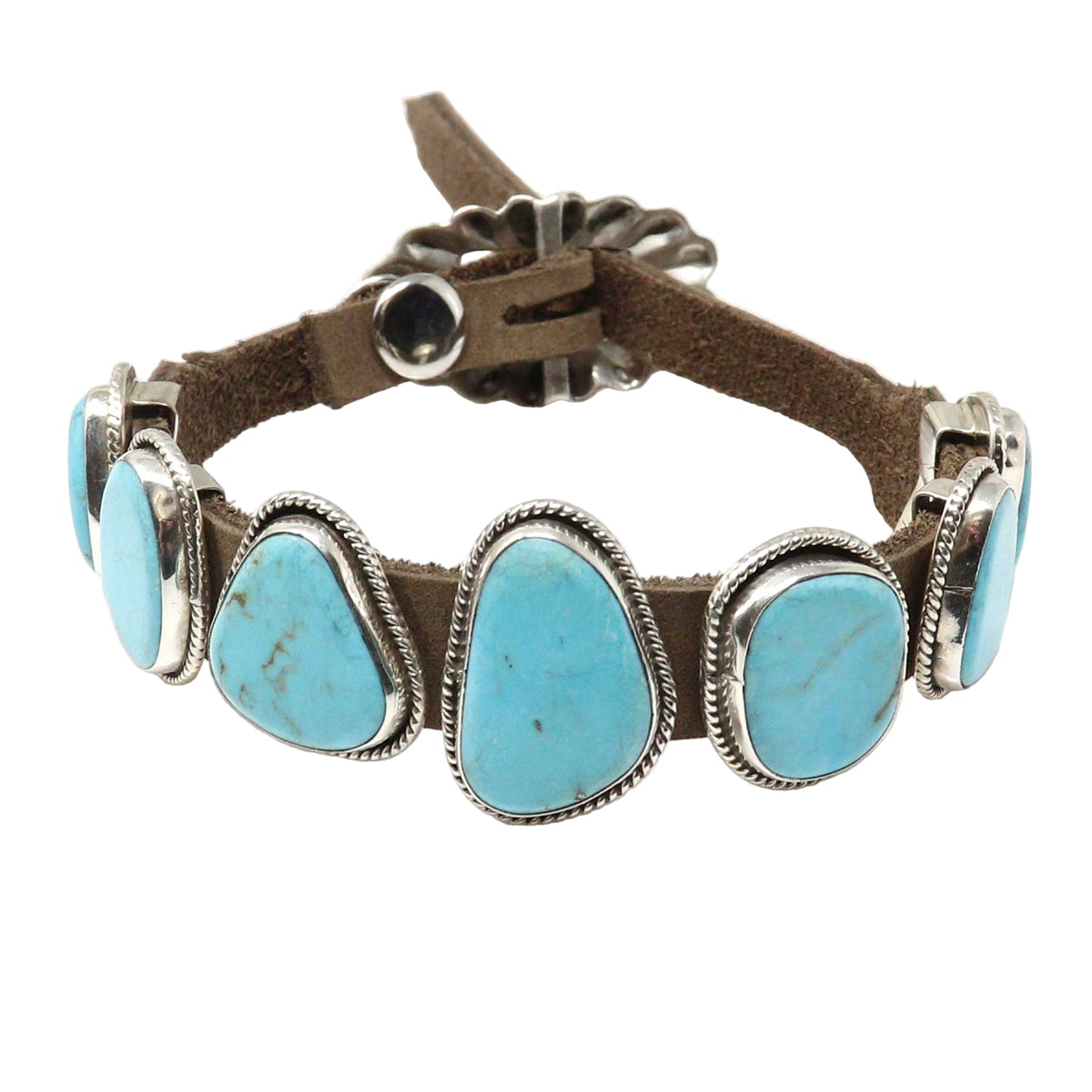 Bracelet with turquoise stones and brown leather strap on a white background
