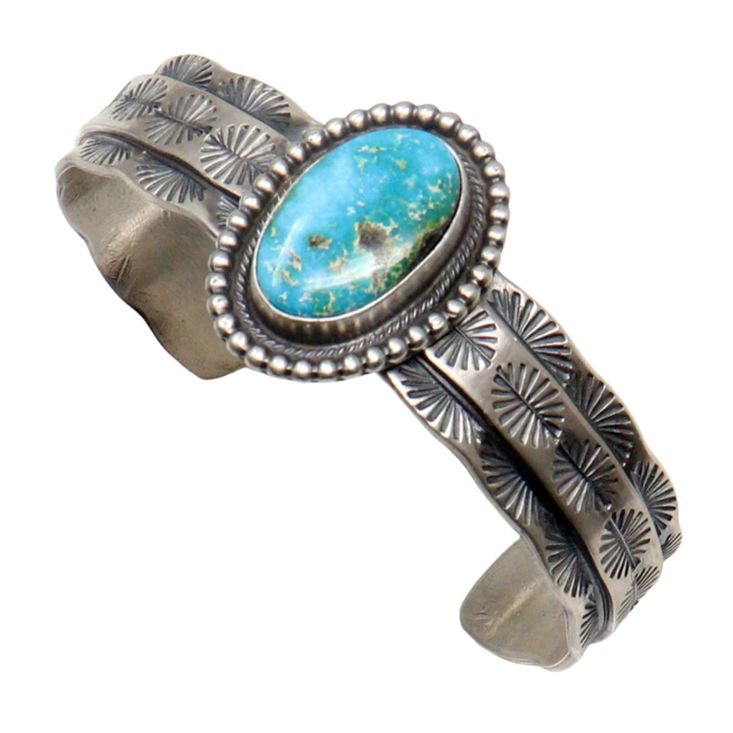 Silver bracelet with turquoise stone on a white background