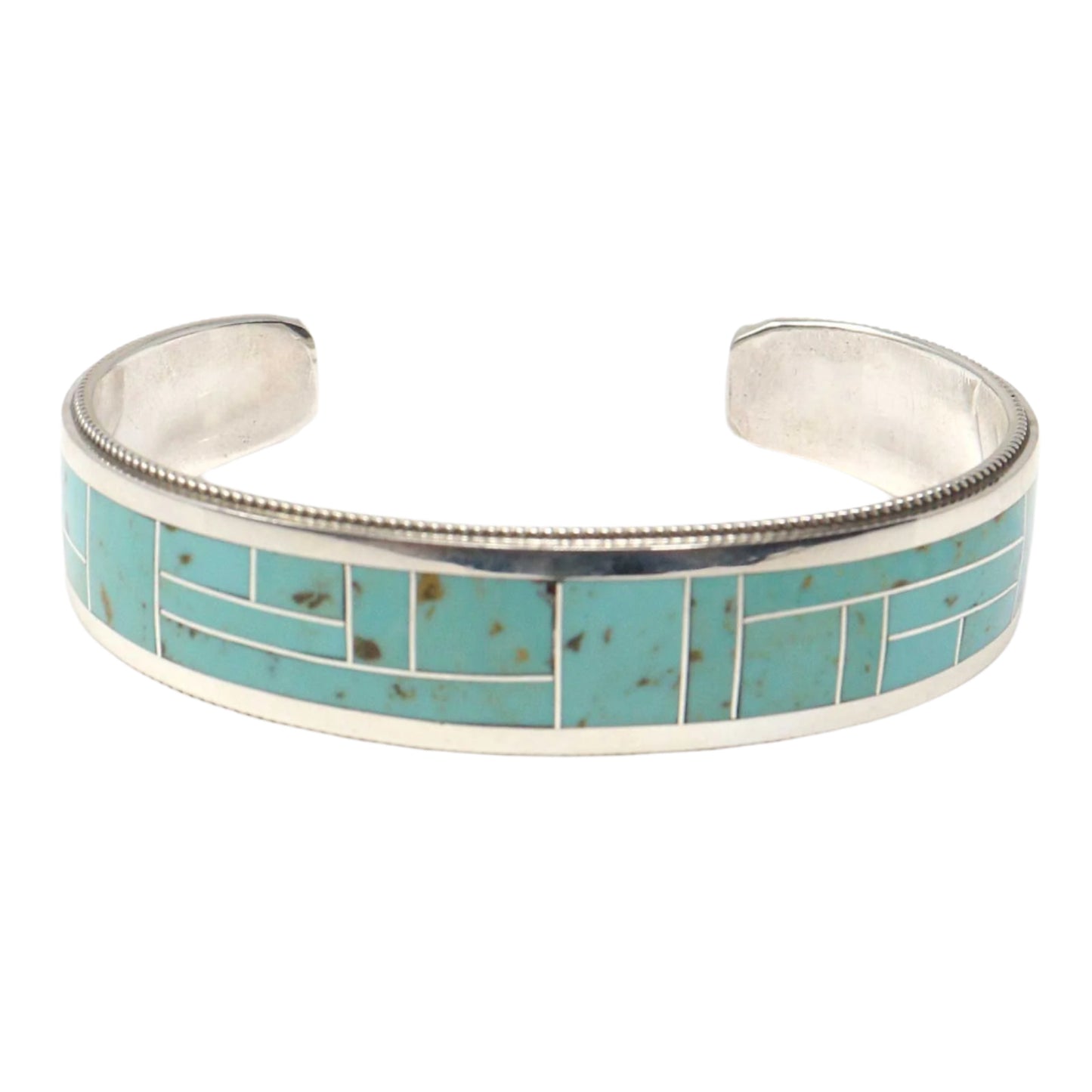 Silver bracelet with turquoise inlay on a white background