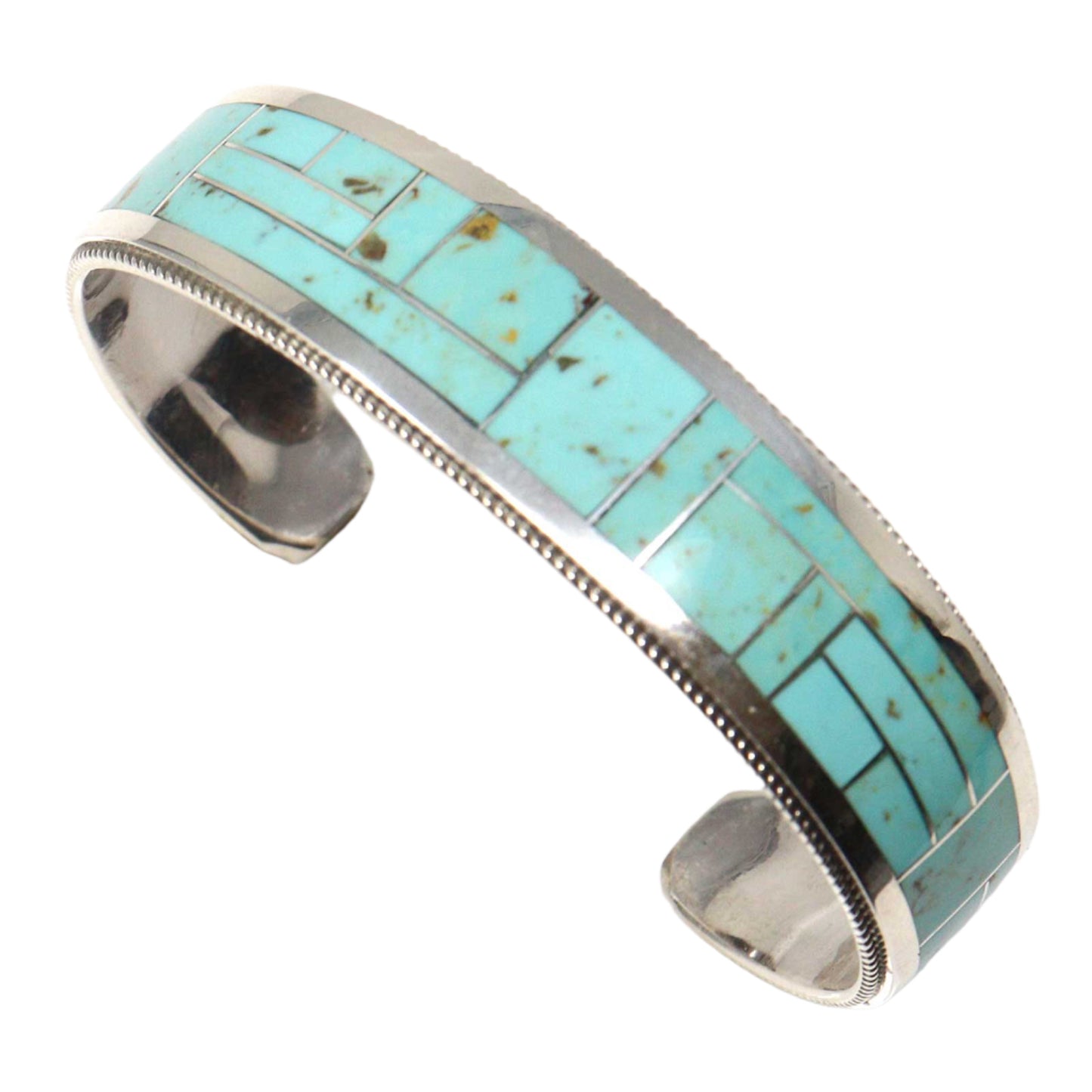 Turquoise inlay bracelet with silver band on a white background