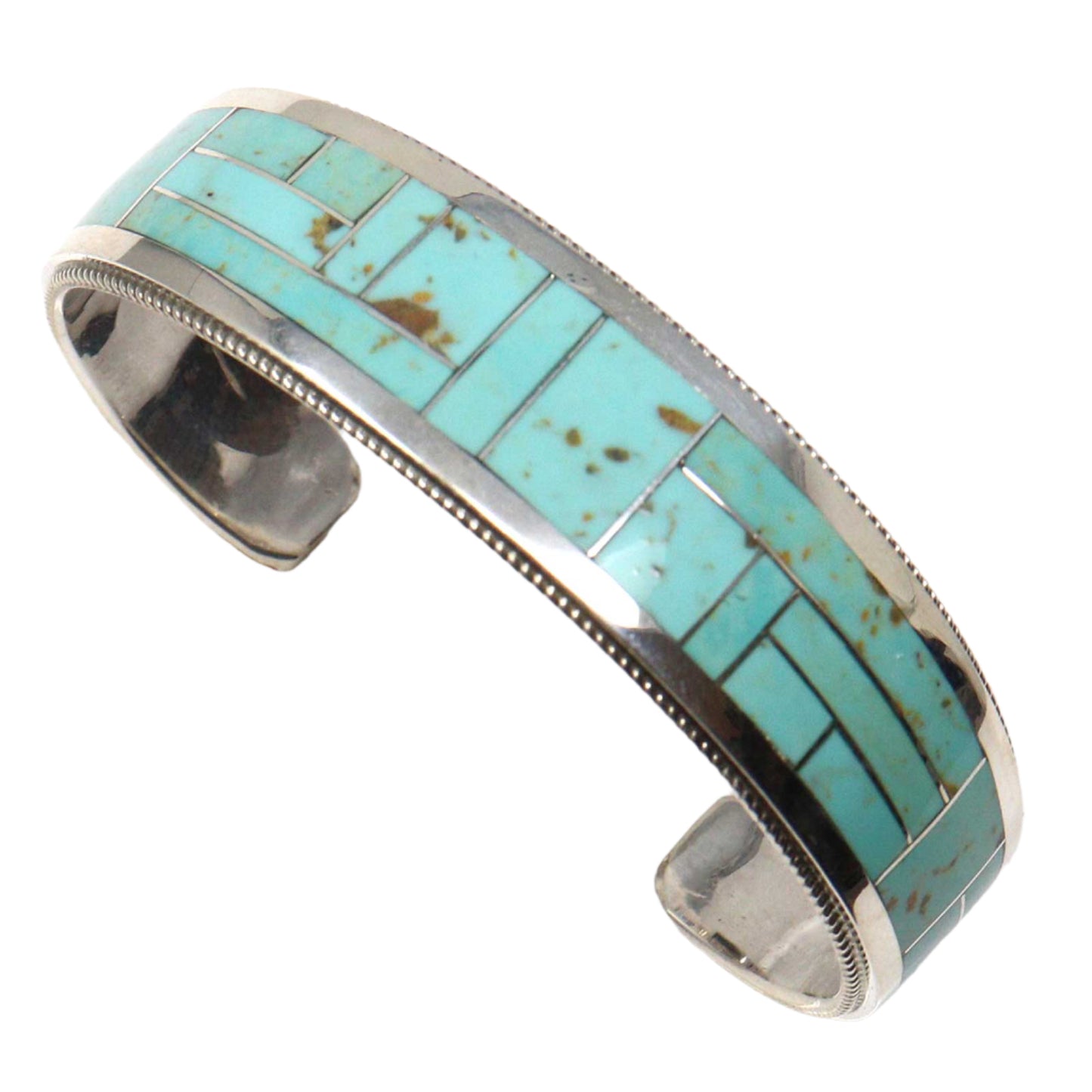 Turquoise inlay bracelet with silver border on a white background