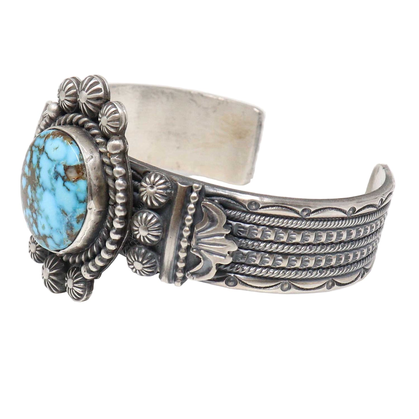 Silver bracelet with turquoise stone on a white background