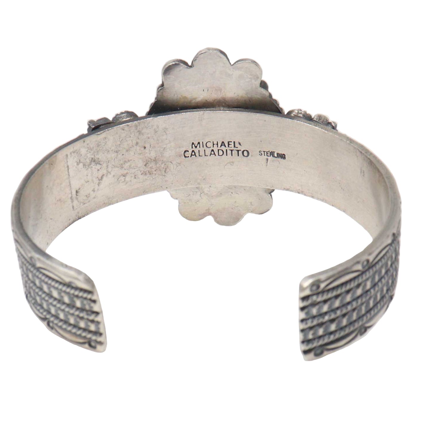 Silver bracelet with 'Michael Calladitto' branding on a white background