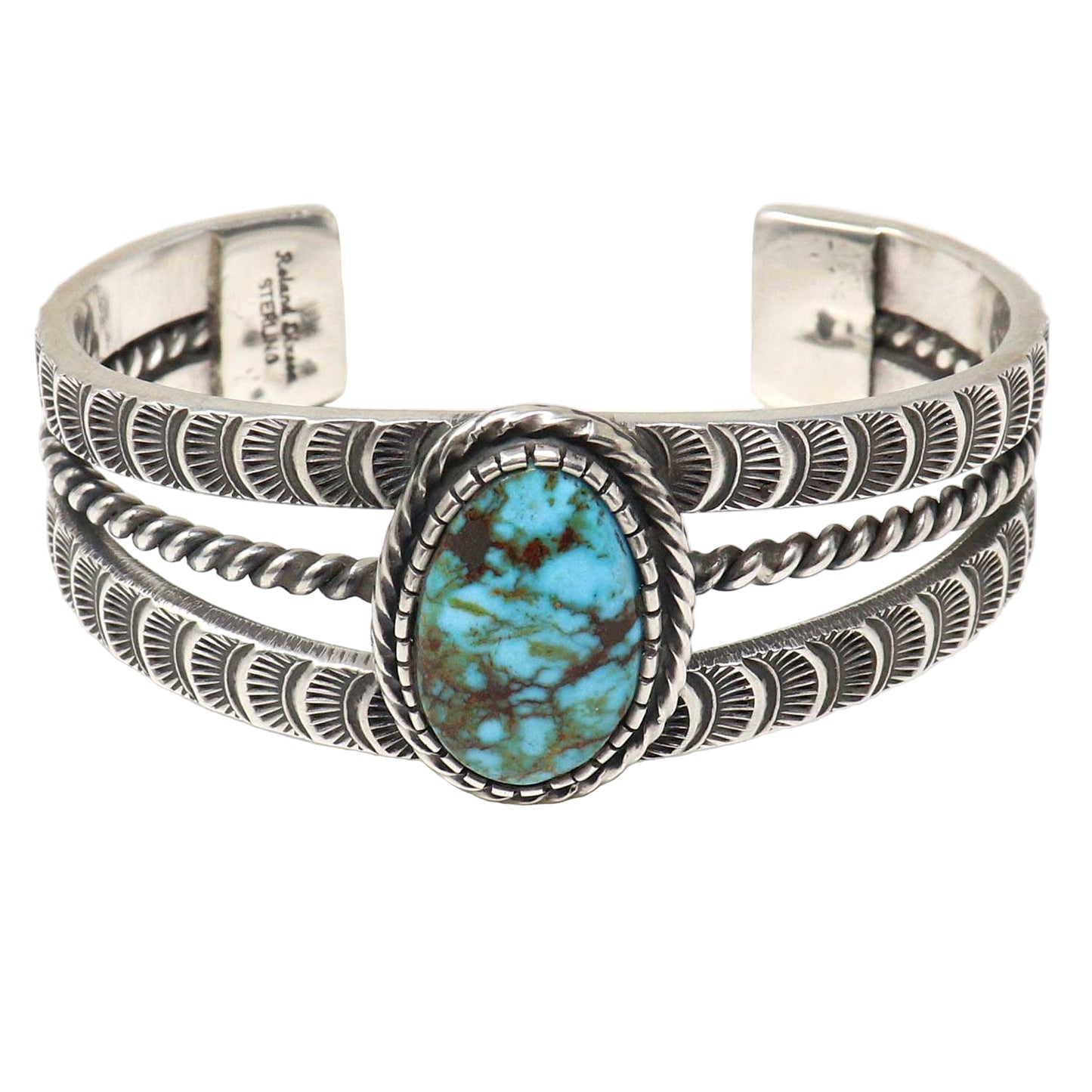 Silver bracelet with turquoise stone on a white background