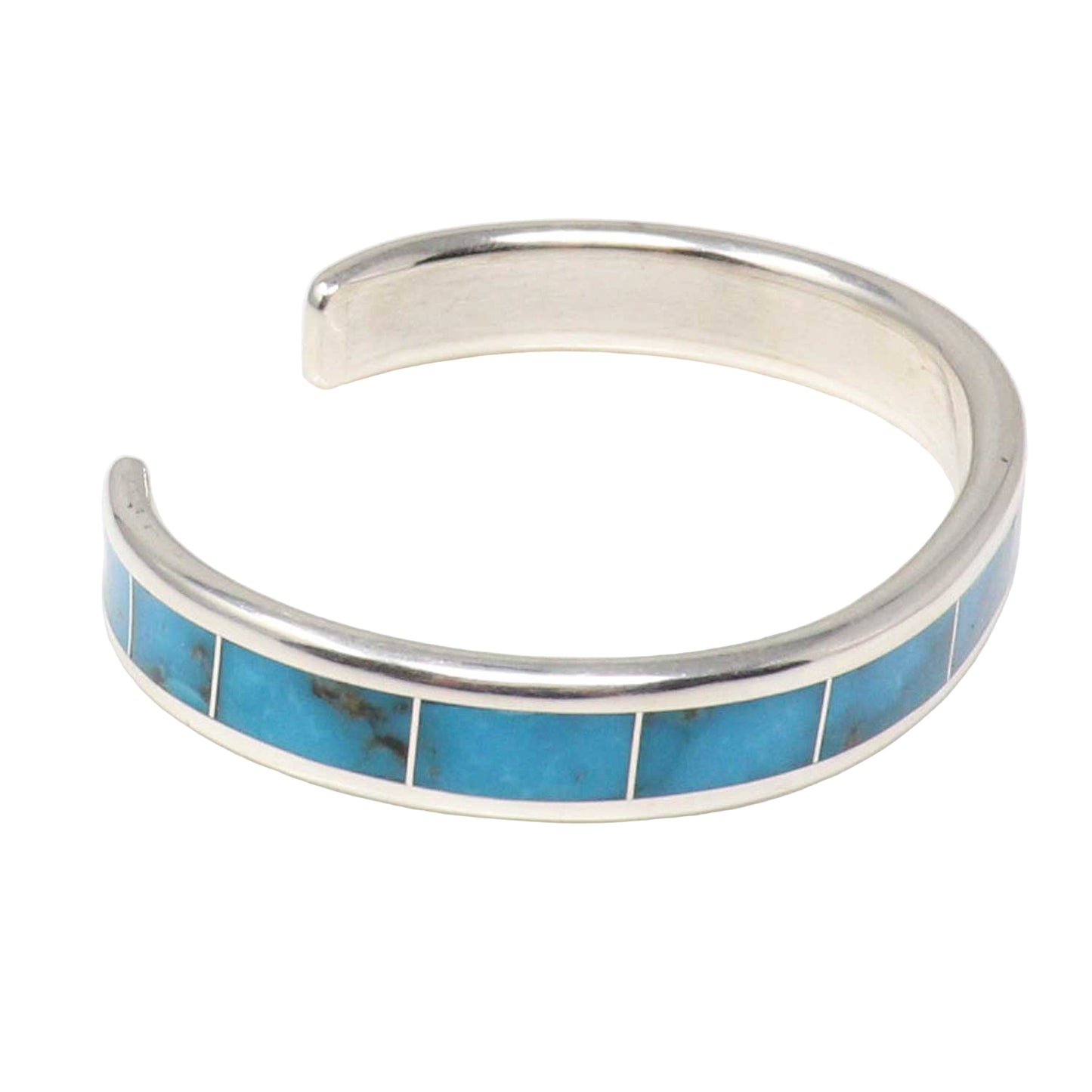Silver bracelet with turquoise inlay on a white background