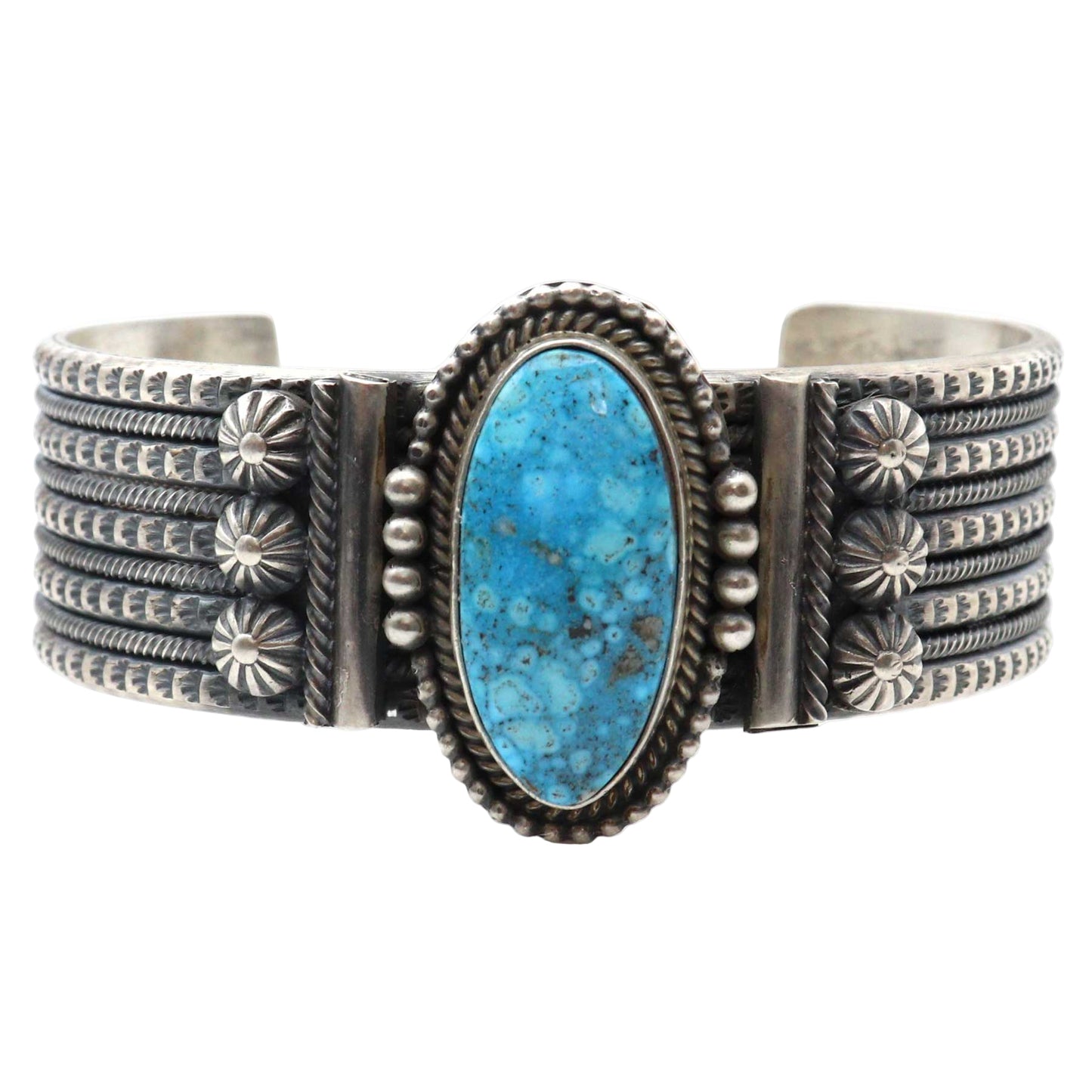 Silver bracelet with a blue stone on a white background