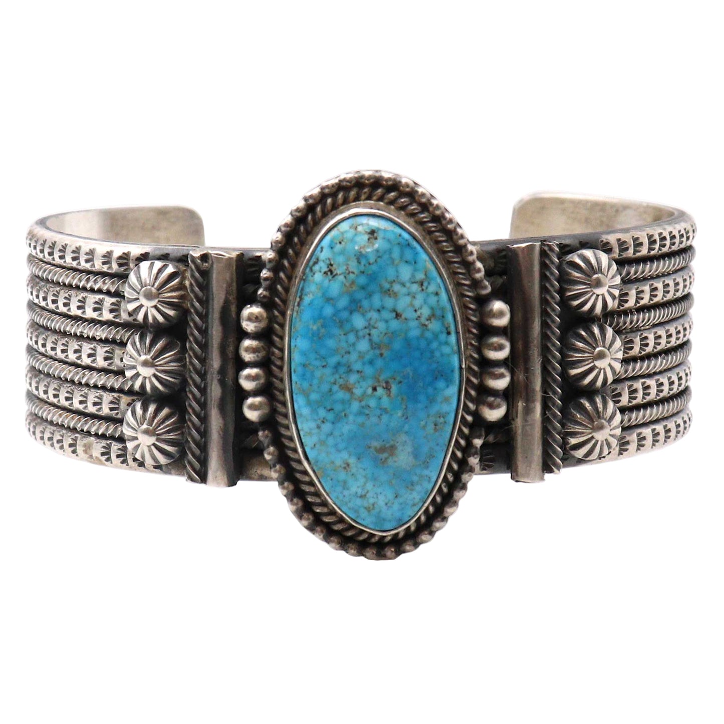 Silver bracelet with a turquoise stone on a white background