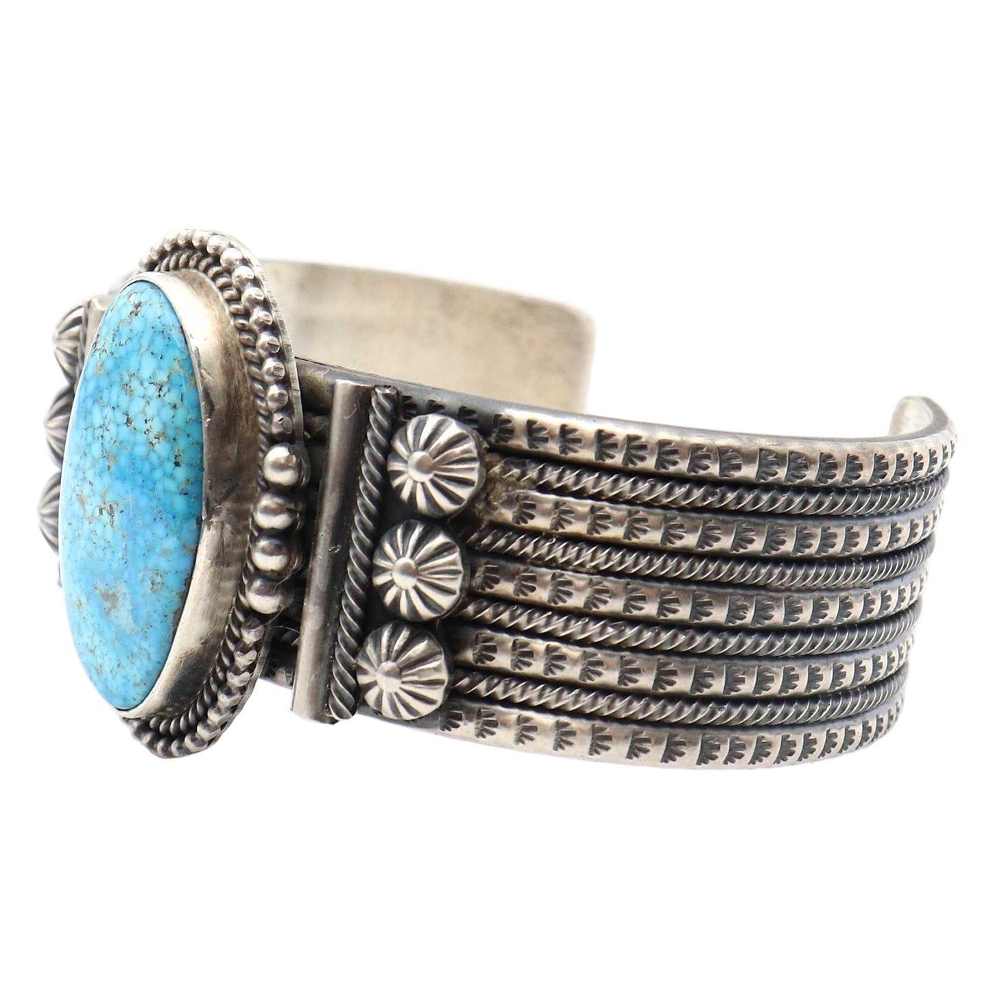 Silver bracelet with turquoise stone on a white background