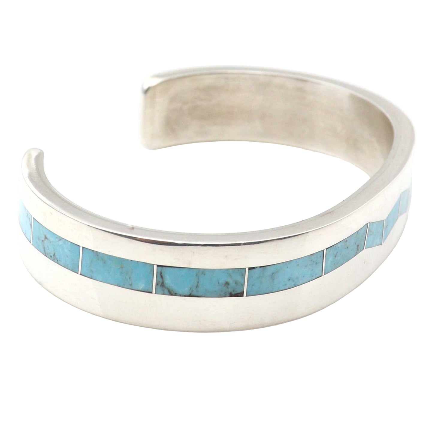 Silver bracelet with turquoise inlay on a white background