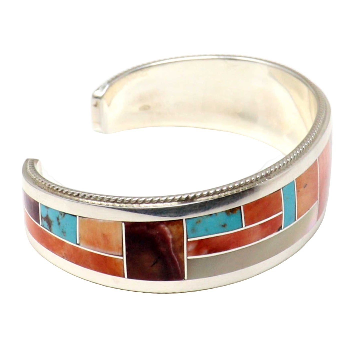 Silver bracelet with colorful stone inlay on a white background