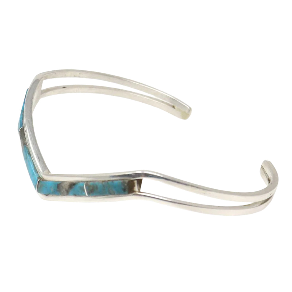 Silver bracelet with turquoise inlay on a white background