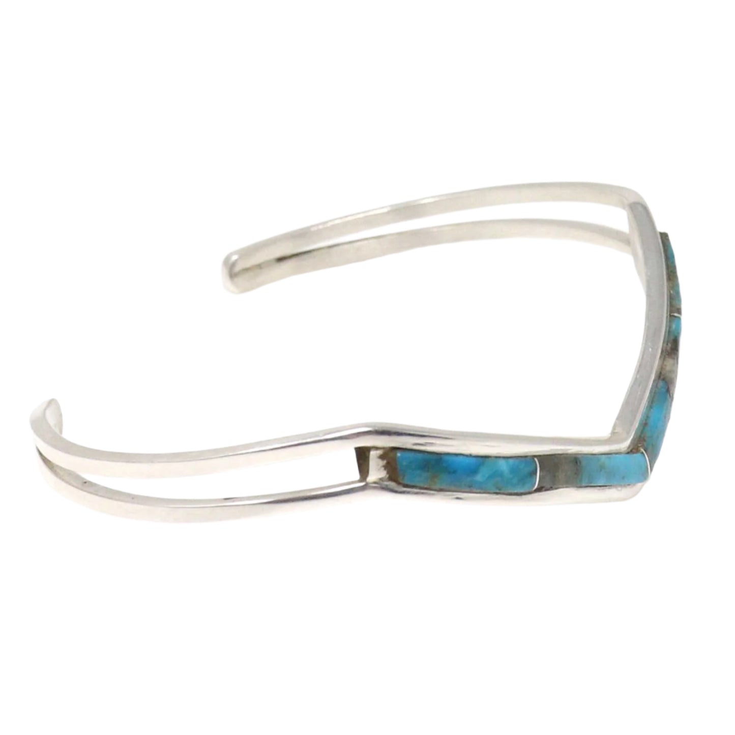 Silver bracelet with turquoise stones on a white background