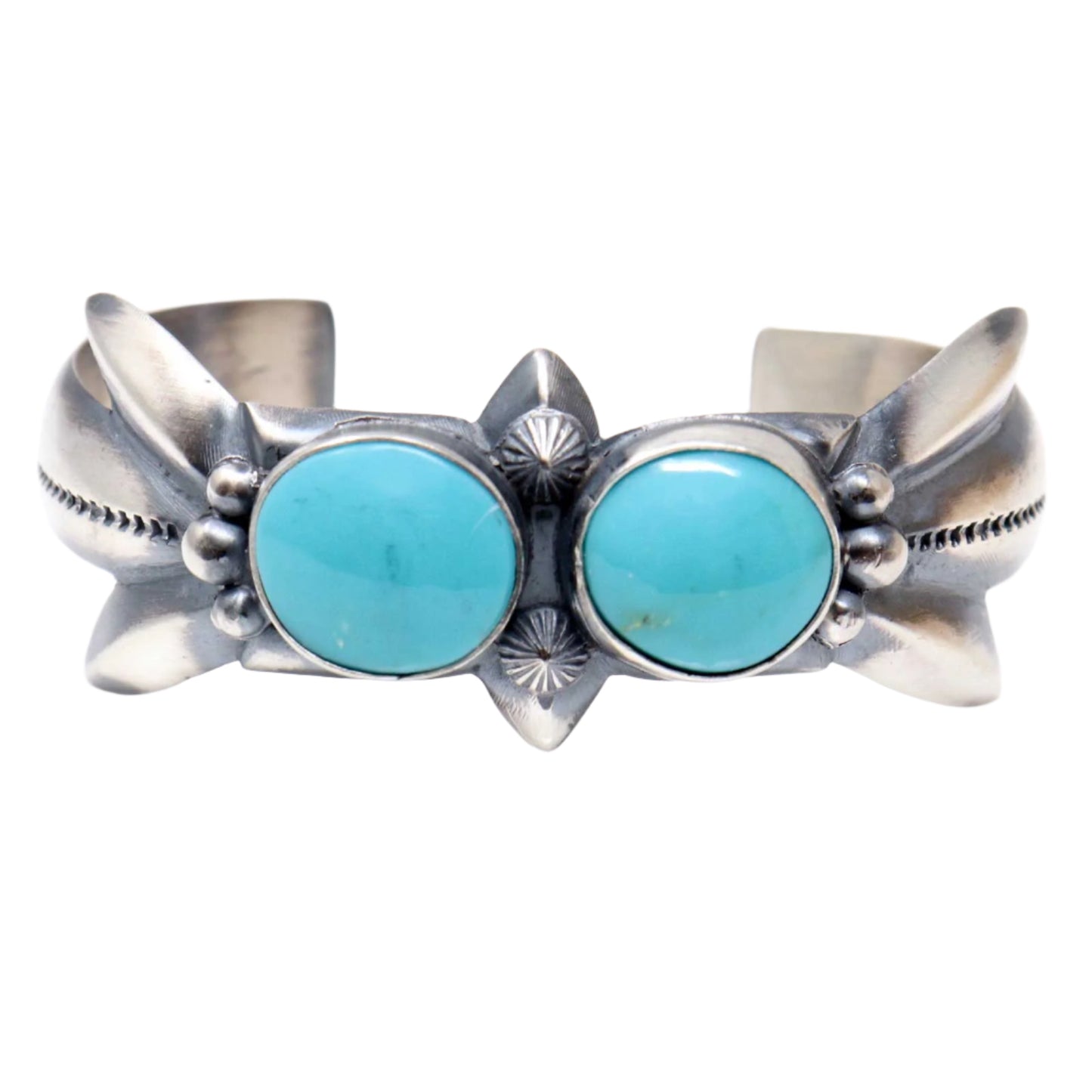 Silver bracelet with two turquoise stones on a white background