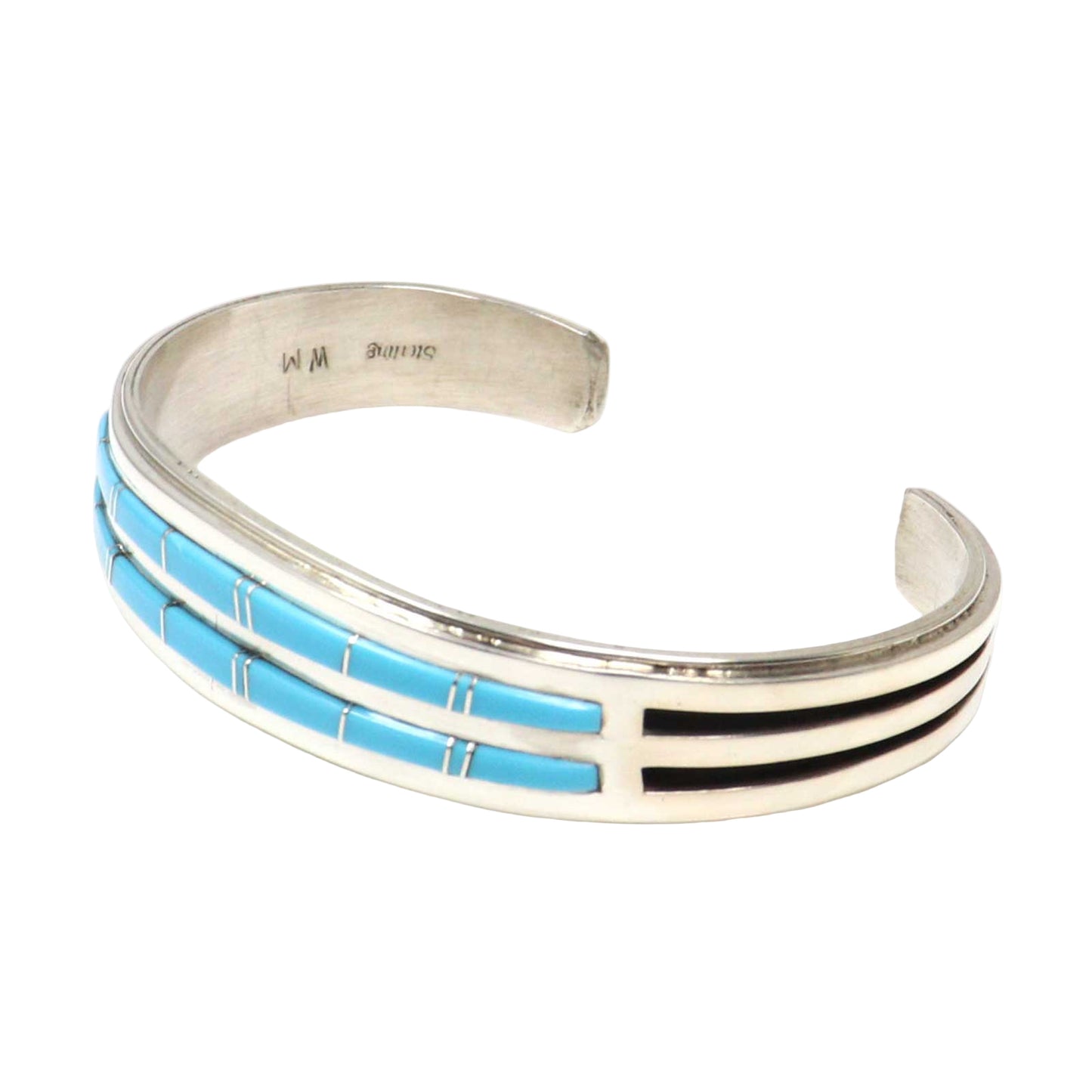Silver bracelet with blue and black inlay on a white background
