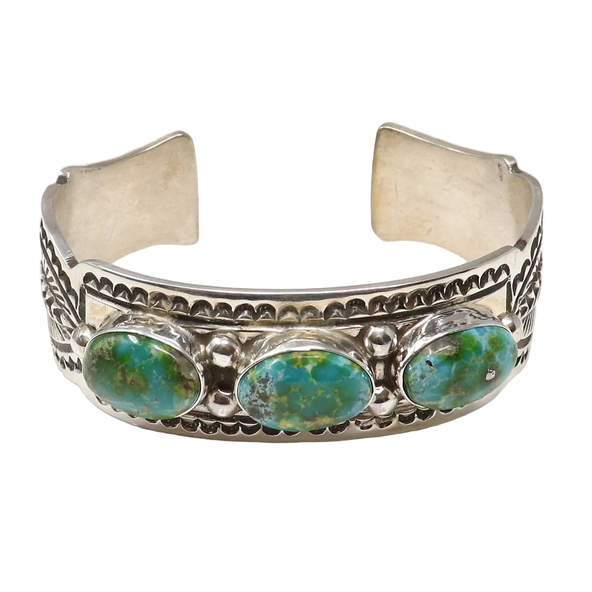 Silver bracelet with turquoise stones on a white background
