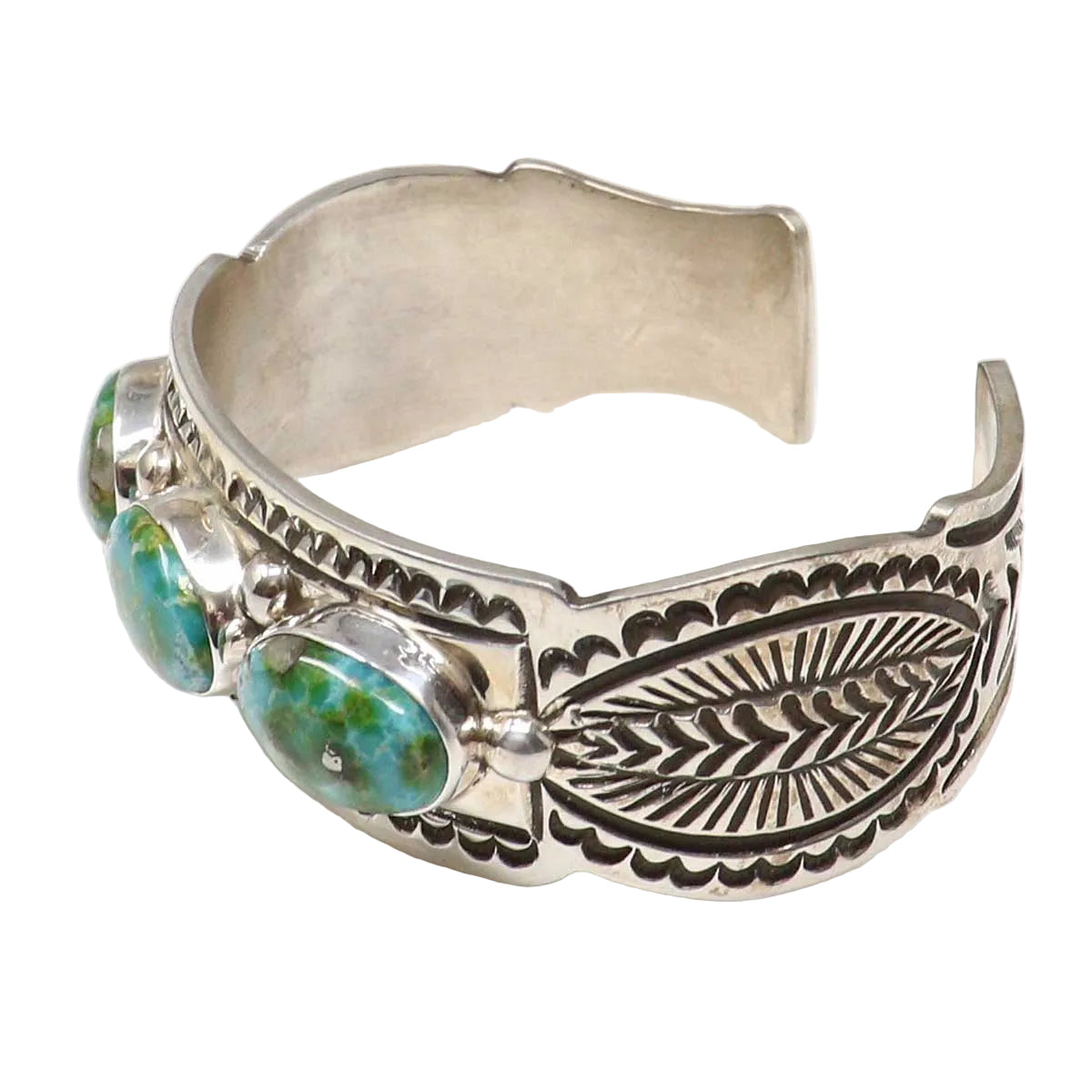 Silver bracelet with turquoise stones on a white background