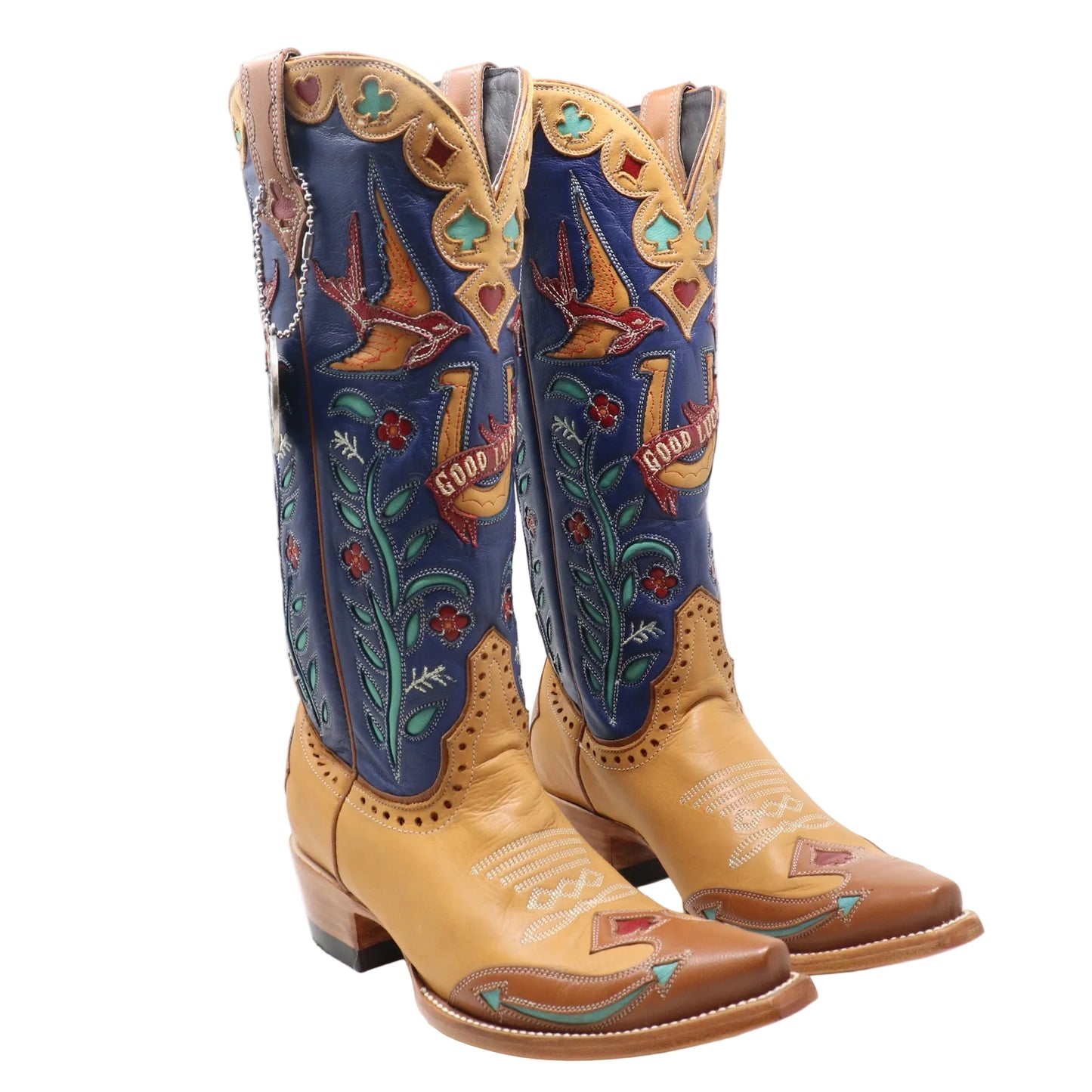 A pair of cowboy boots with tan leather feet and dark blue shafts decorated with colorful embroidered birds, floral patterns, and western-style designs.