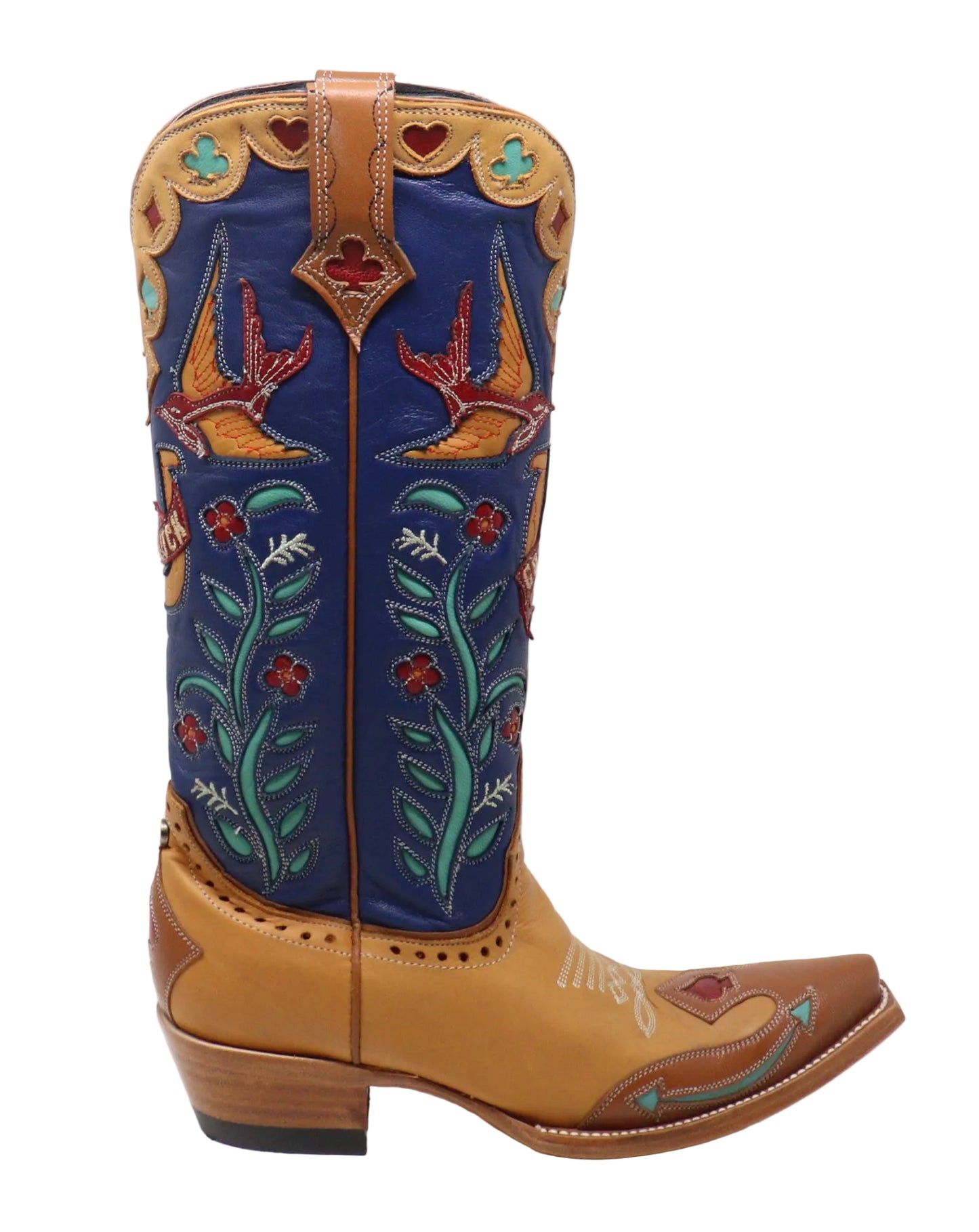 A single western cowboy boot shown in side profile against a plain white studio background. The boot has a tan leather foot and vamp with decorative embroidered floral details, a dark blue shaft, and multicolored embroidery including turquoise, red, orange, and white.