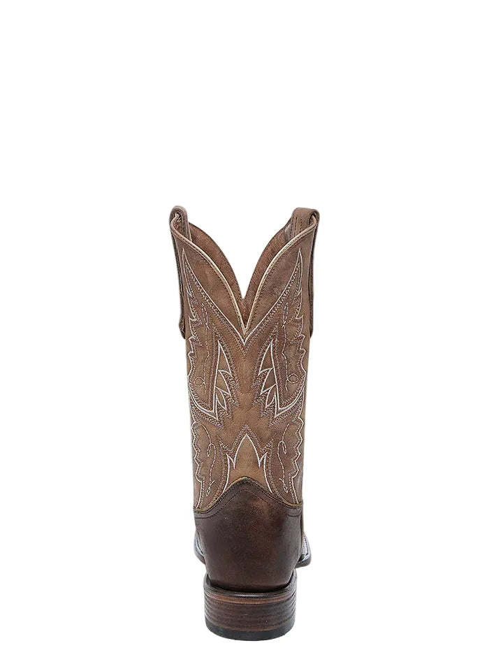 Brown cowboy boot with intricate patterns on a white background
