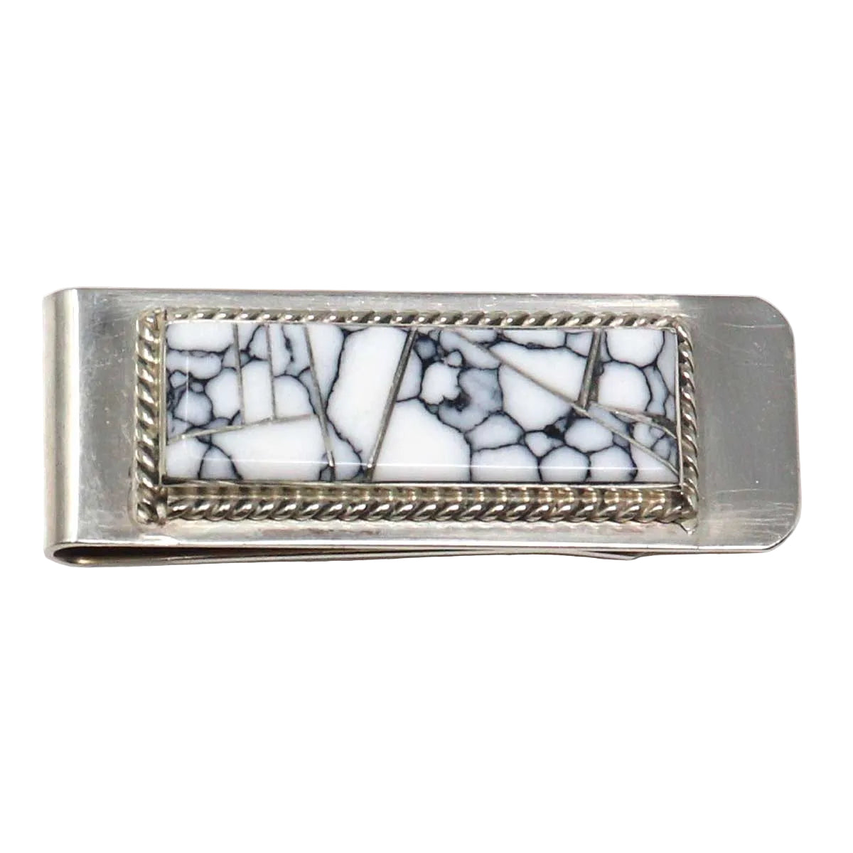 Silver money clip with white and black mosaic design on a white background