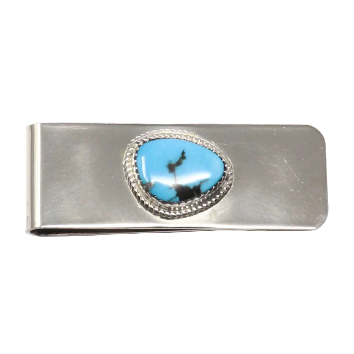 Silver money clip with a blue stone on a white background