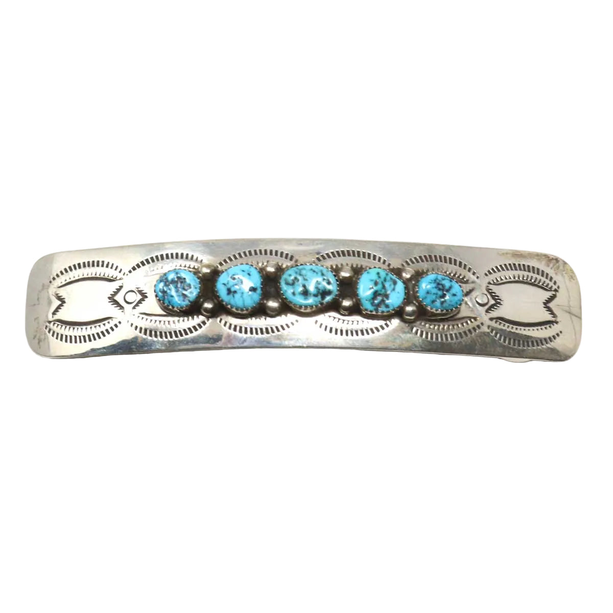 Silver barrette with turquoise stones on a white background