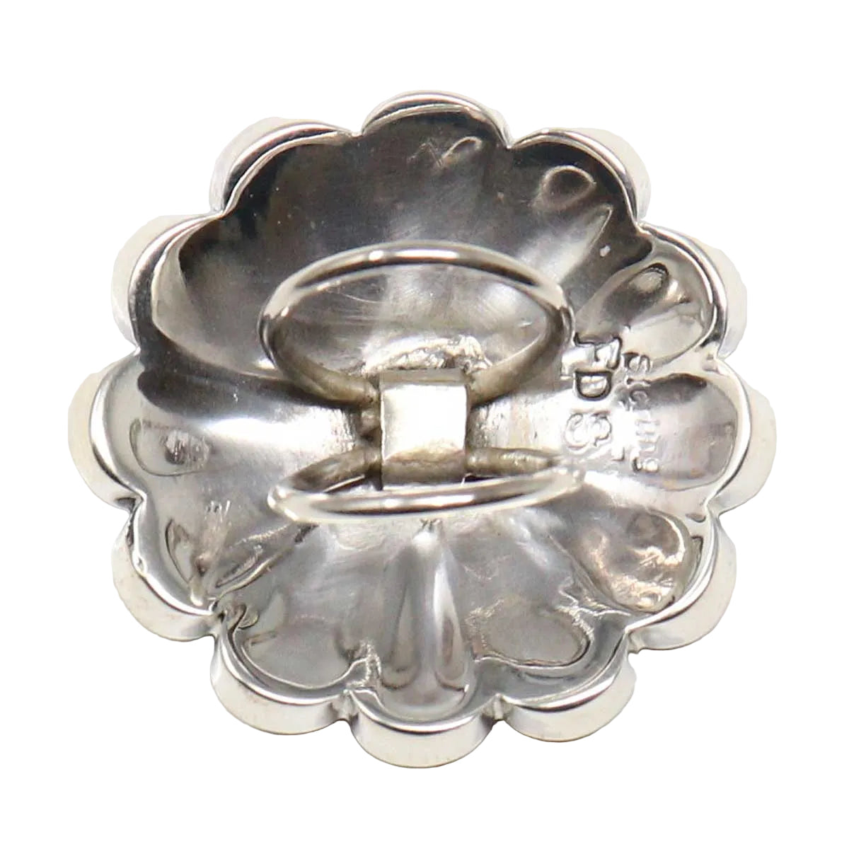 Reverse of a Zuni inlaid start slide  on a white background