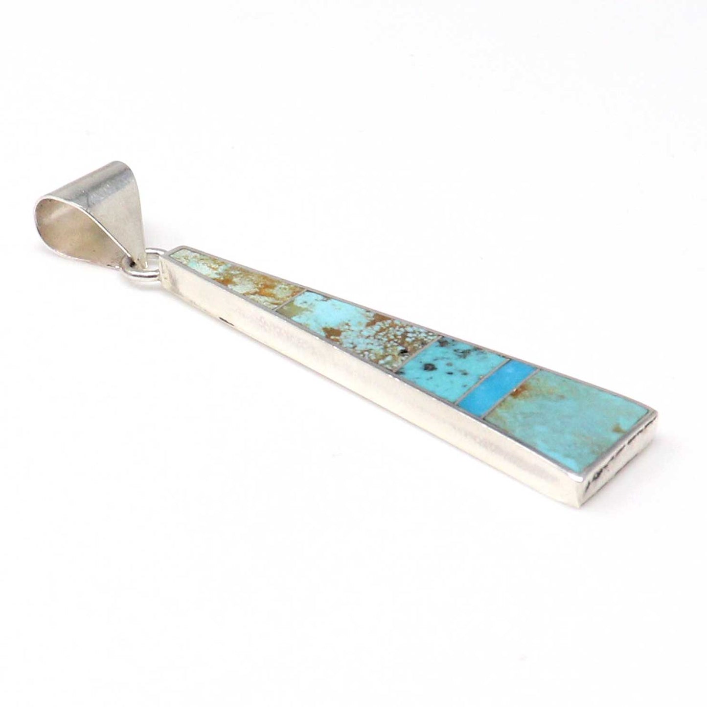 Turquoise inlay pendant on a white background