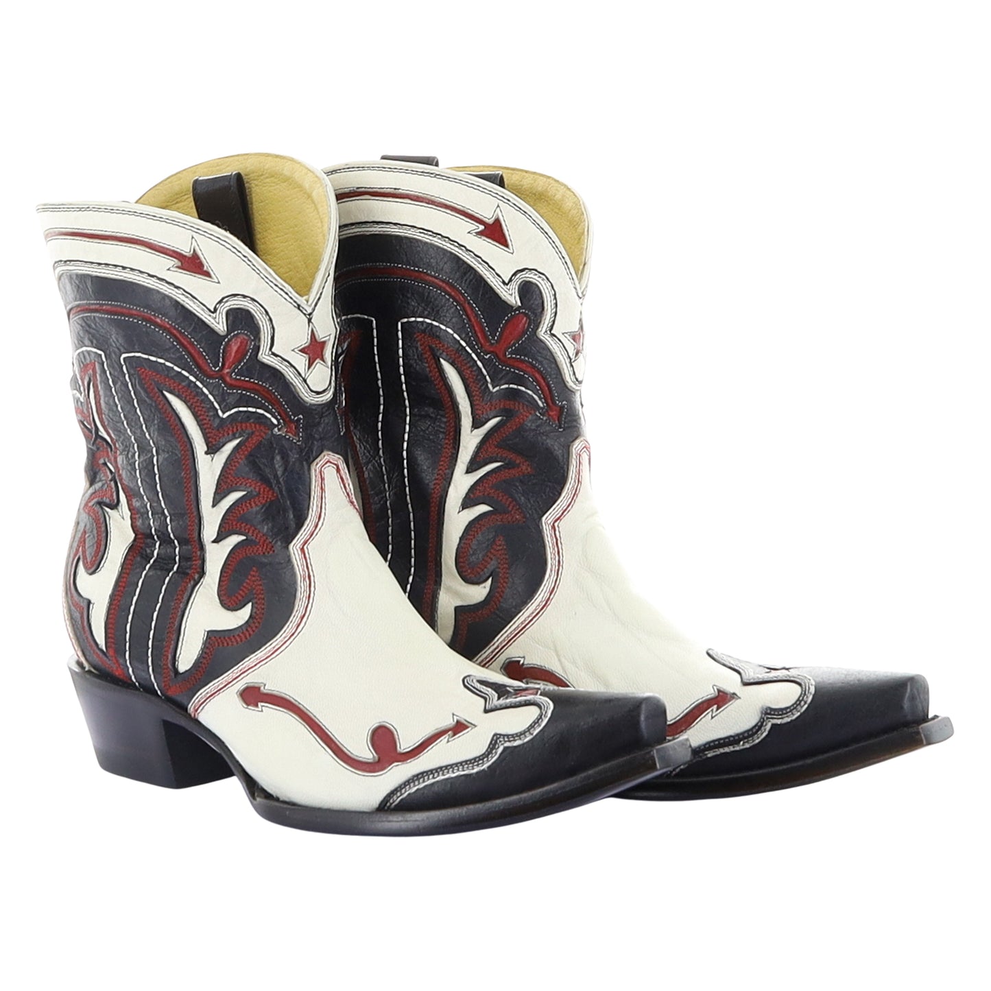 Pair of white and black cowboy boots with red stitching on a white background