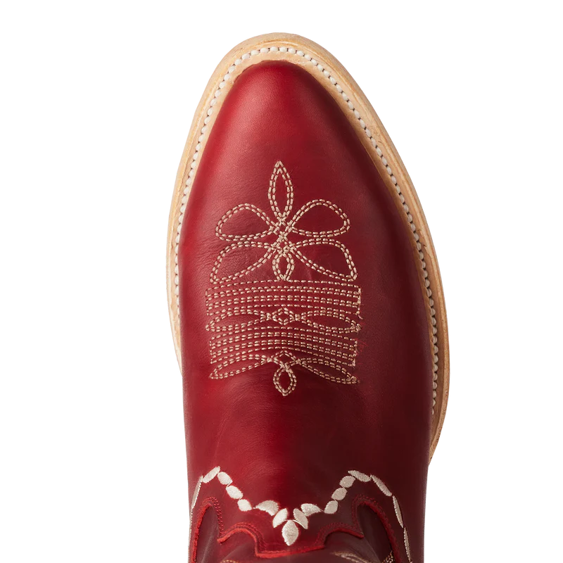 Red cowboy boot with white embroidery on a white background