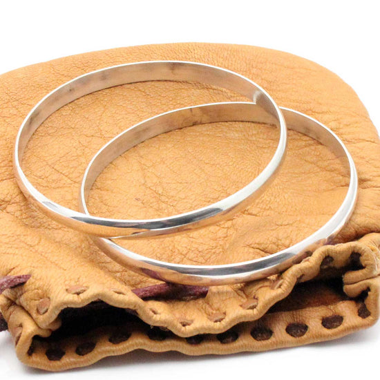 Silver quarter round wire bangle By Elaine Tahe