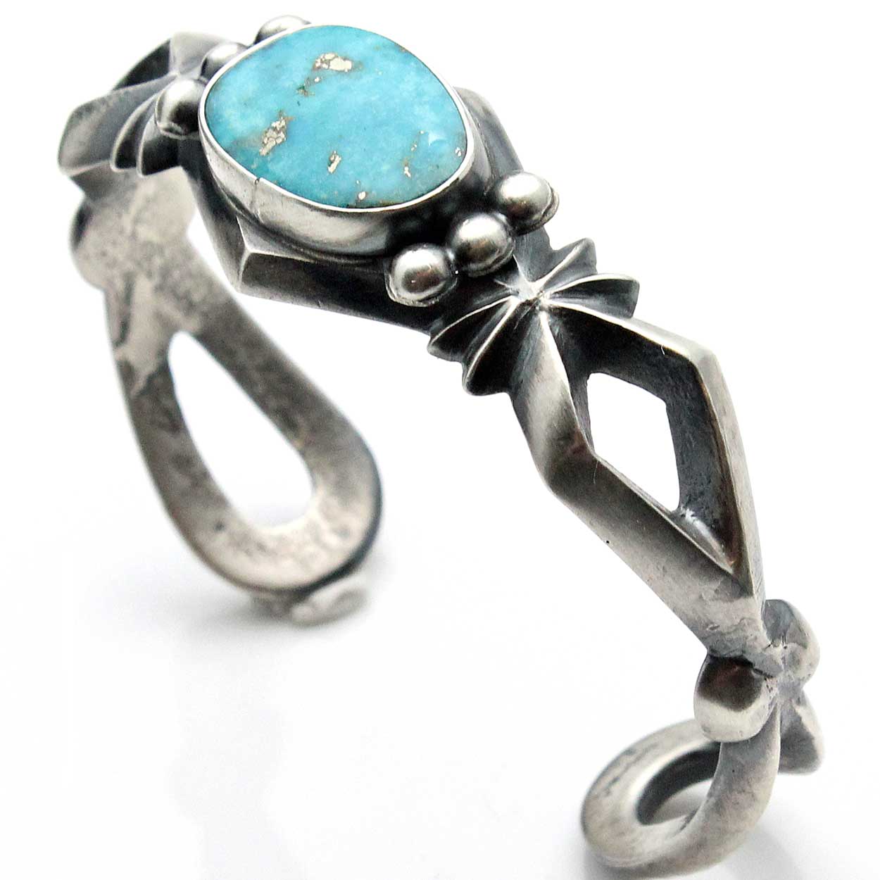 Navajo Silver Cast Bracelet with Turquoise by Harrison Bitsui